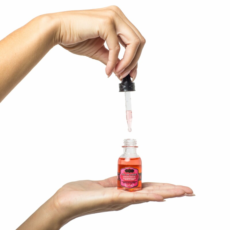 Масло для поцілунків їстівне з розігрівом Kama Sutra OIL OF LOVE Tropic Mango 22 ML